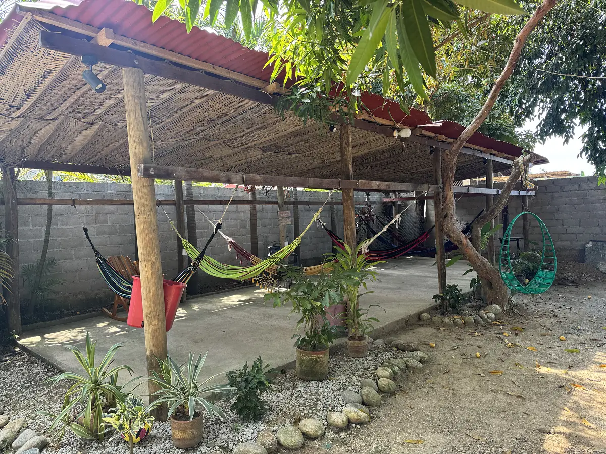 Chill area with hammocks at Hostal La Perla Buritaca